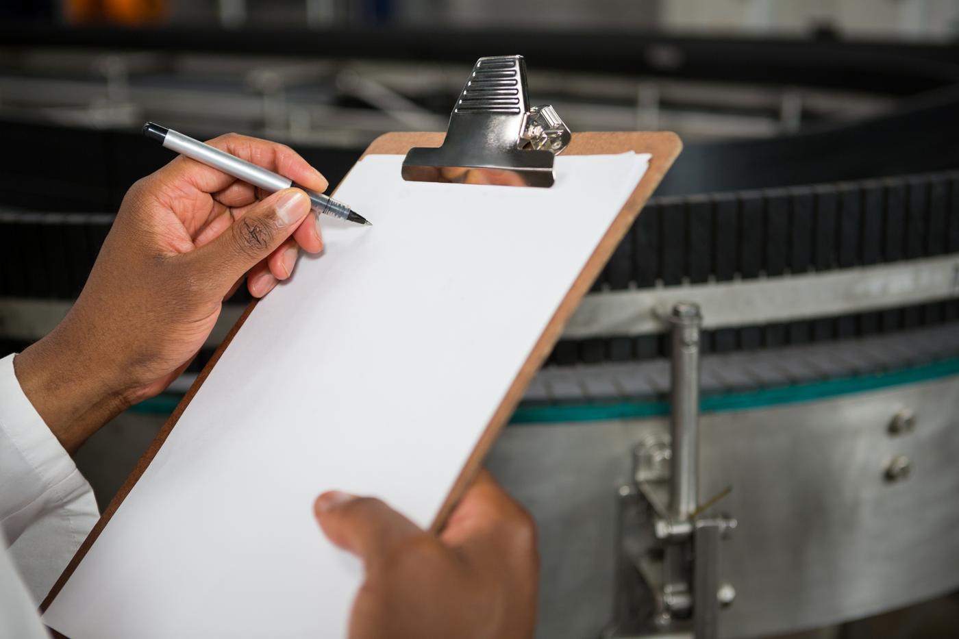 Quality inspector with a clipboard